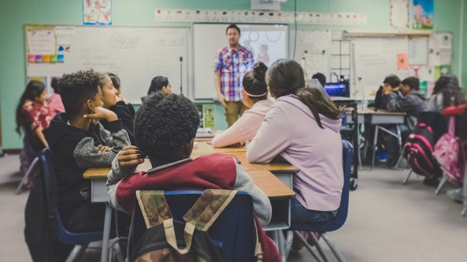 Teachers and students using a school learning management system